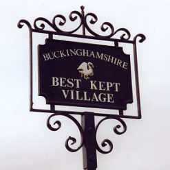 'Best Kept Village' sign made by Gommes Forge